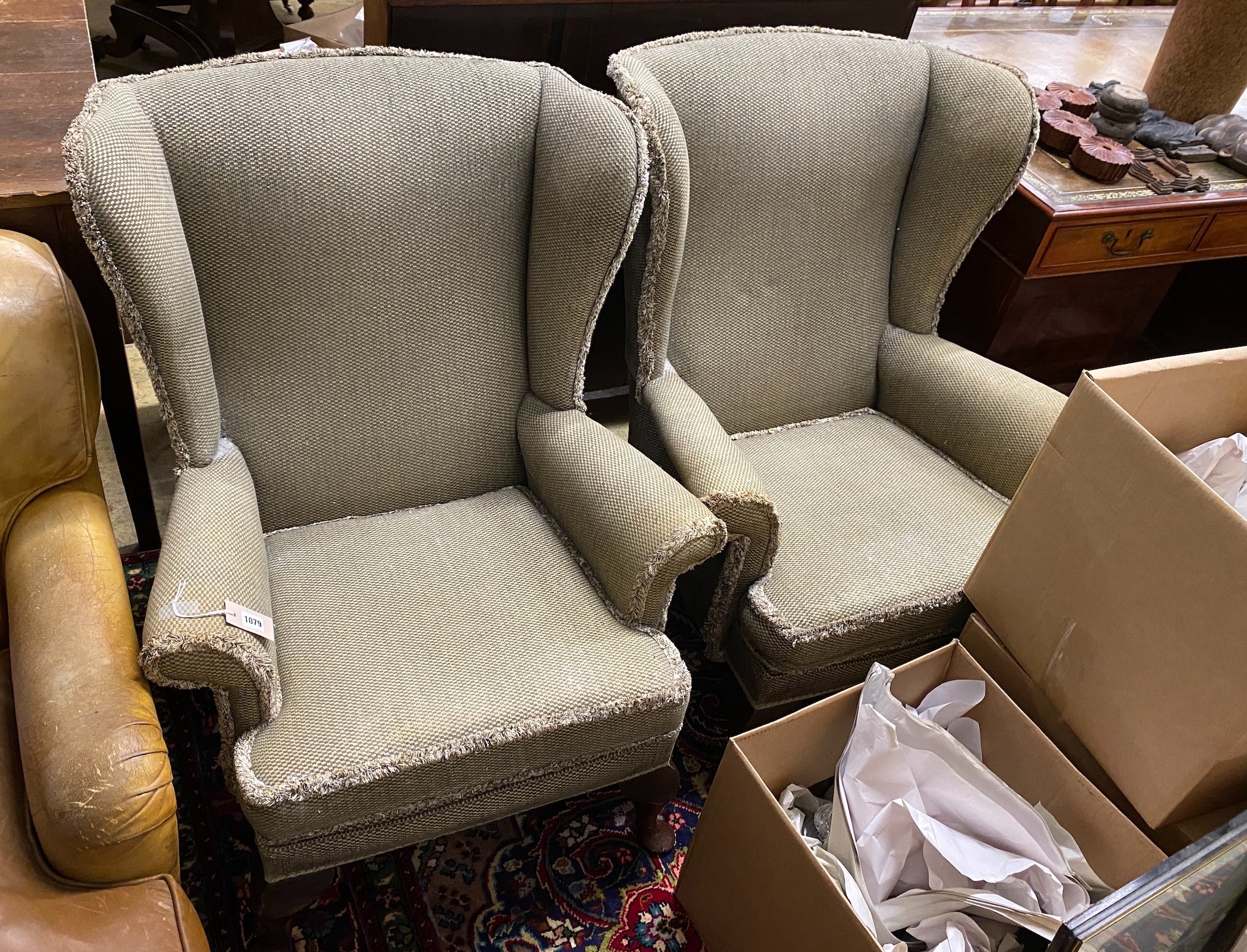 A pair of modern upholstered wing armchairs, width 75cm, depth 70cm, height 96cm